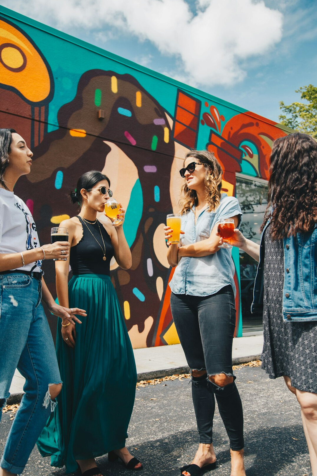 Group of friends and colleagues talking and laughing together