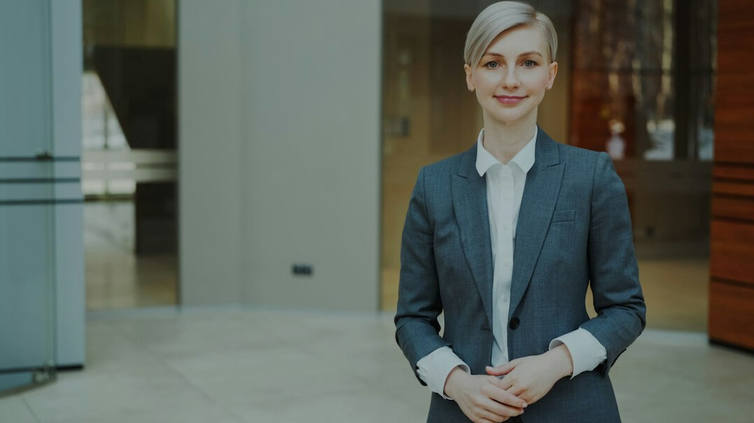 Friendly office team greeting visitors in a bright office